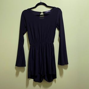 Black long-sleeved romper from Ross. Size S. Has hooks to add clip on necklace